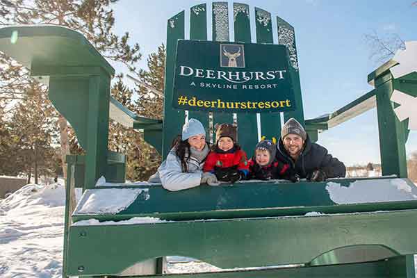 ToDoOntario - Deerhurst Resort, family on big chair, winter